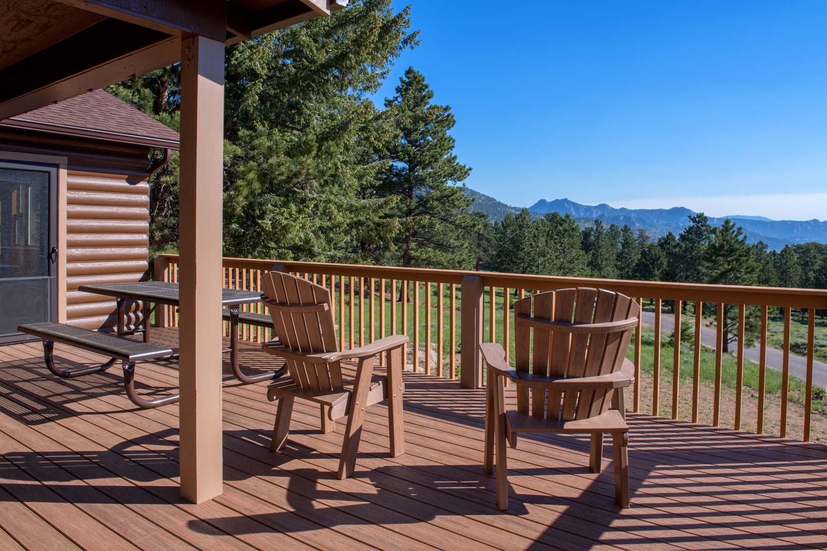 Outdoor patio with chairs overlooking the mountains