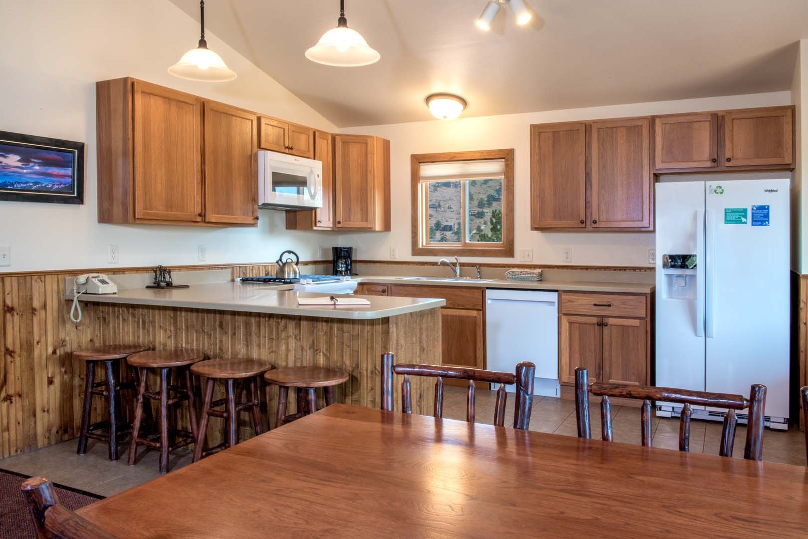 Kitchen inside cabin with kitchen table and chairs