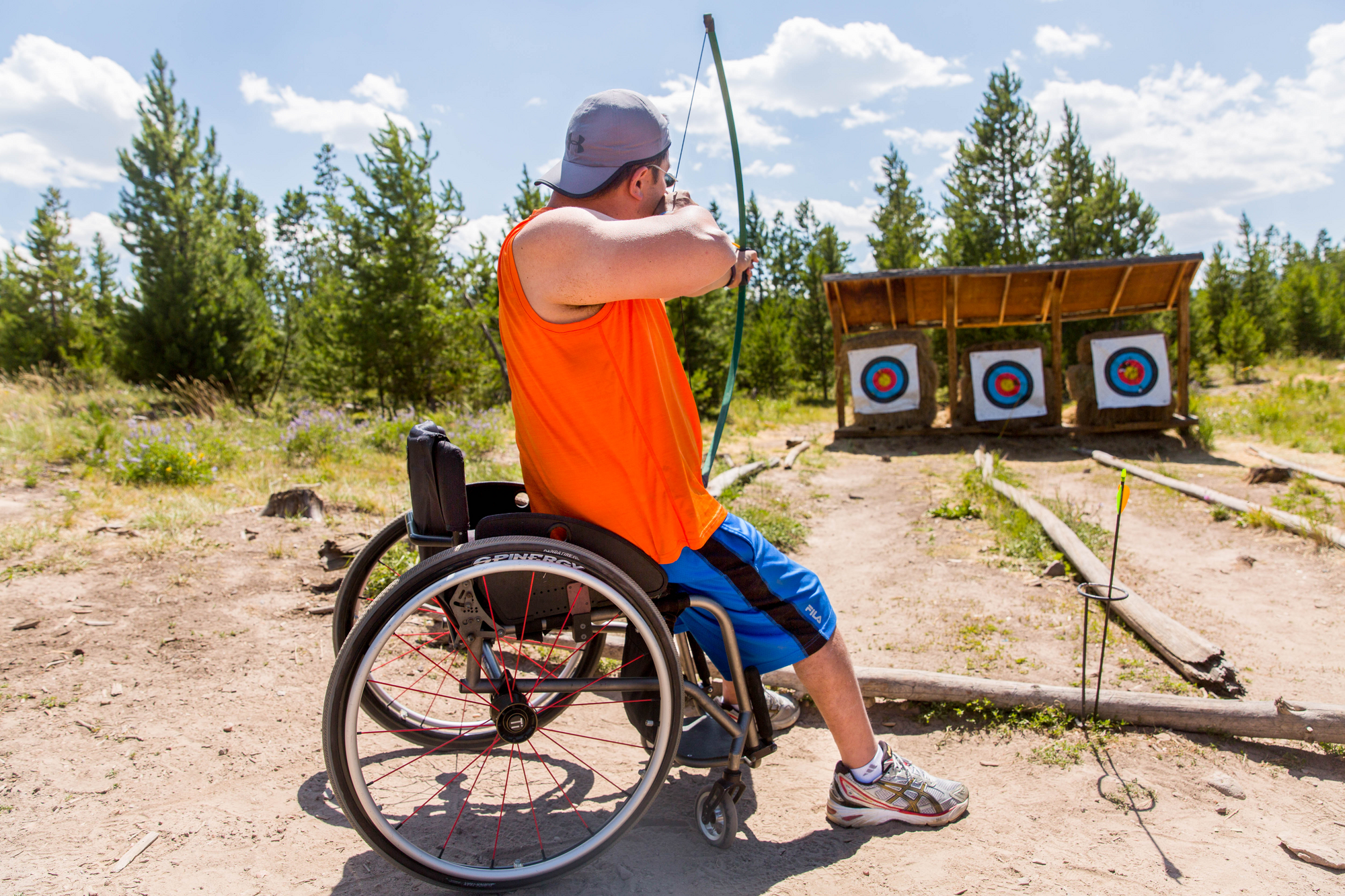 man in wheelchair doing archey