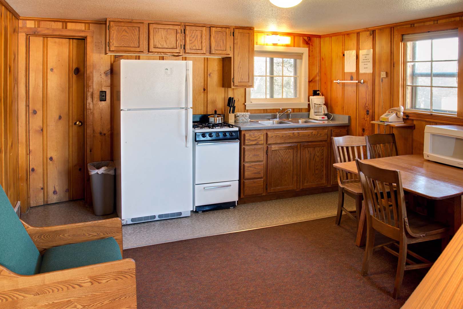 Kitchen inside cabin with kitchen table and chairs