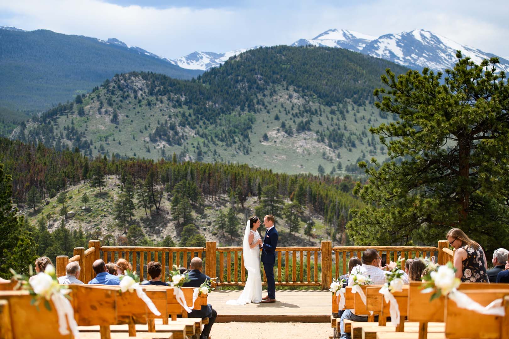 Couple getting married outside in front of mountains