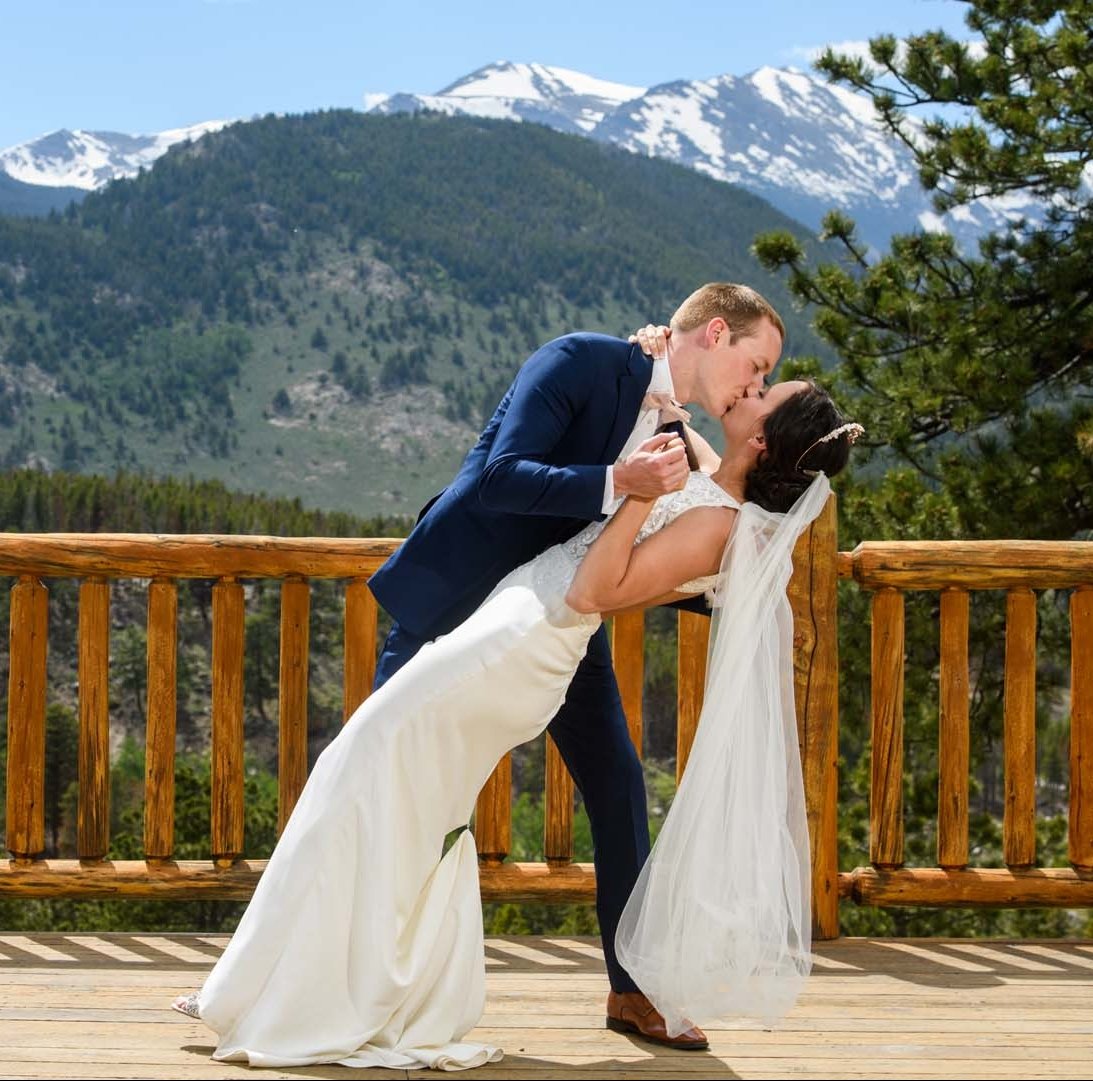 Couple getting married outside in front of mountains