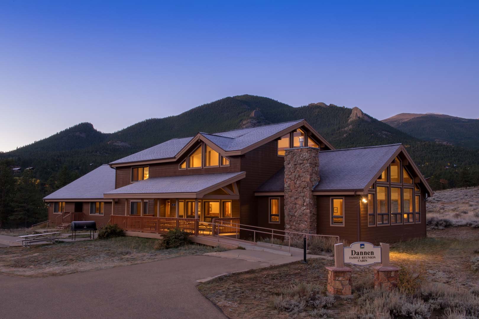 Cabin at night with mountains in background