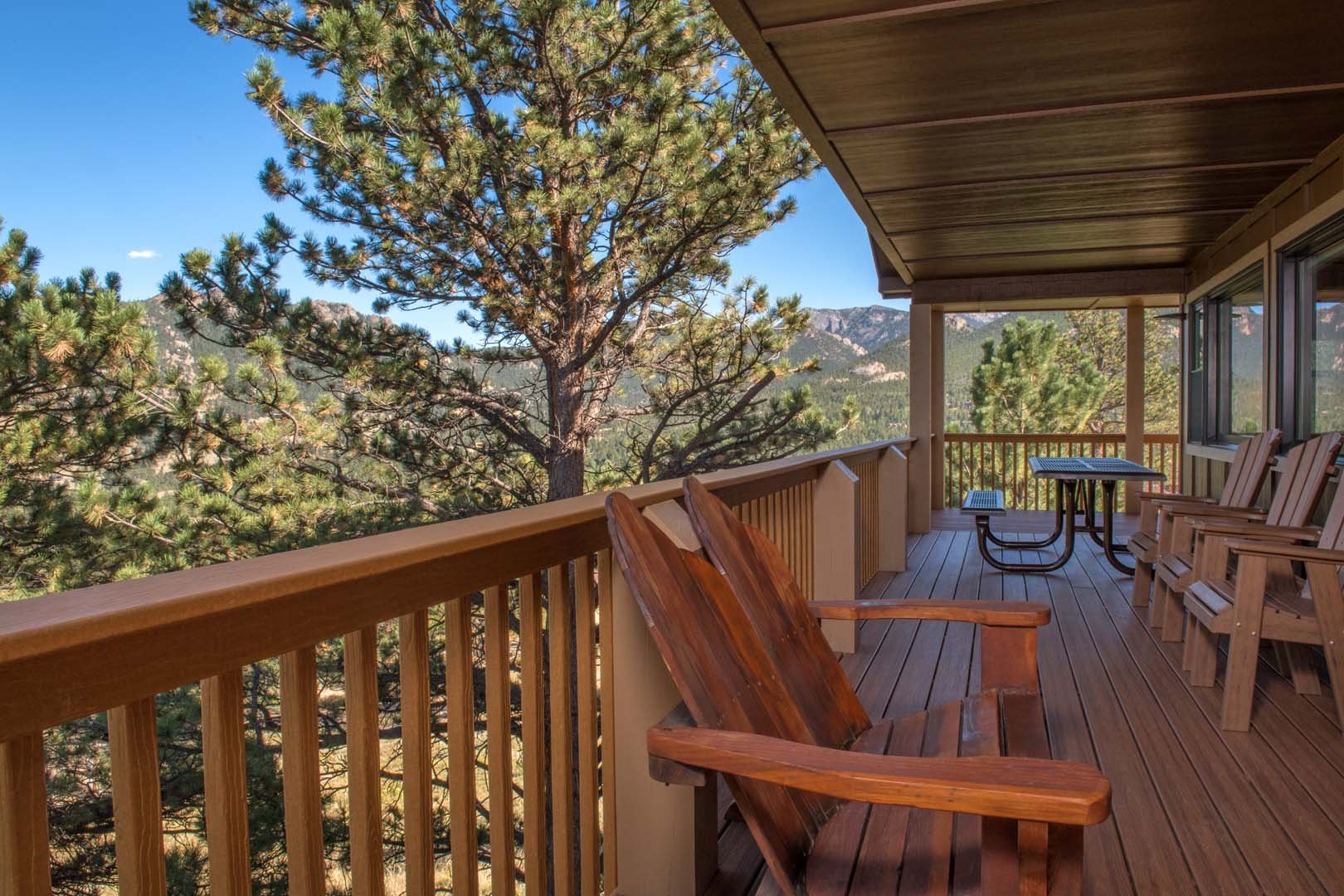 Outdoor patio with chairs overlooking the mountains