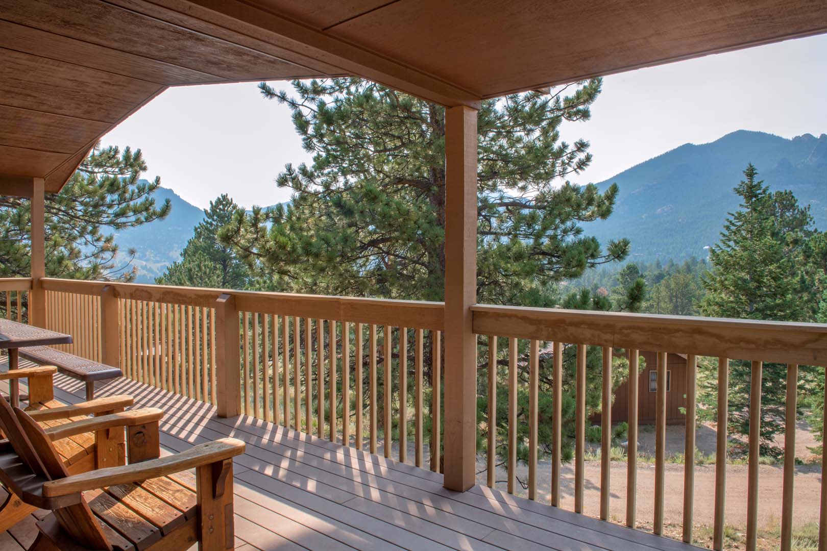 Outdoor patio with chairs overlooking the mountains