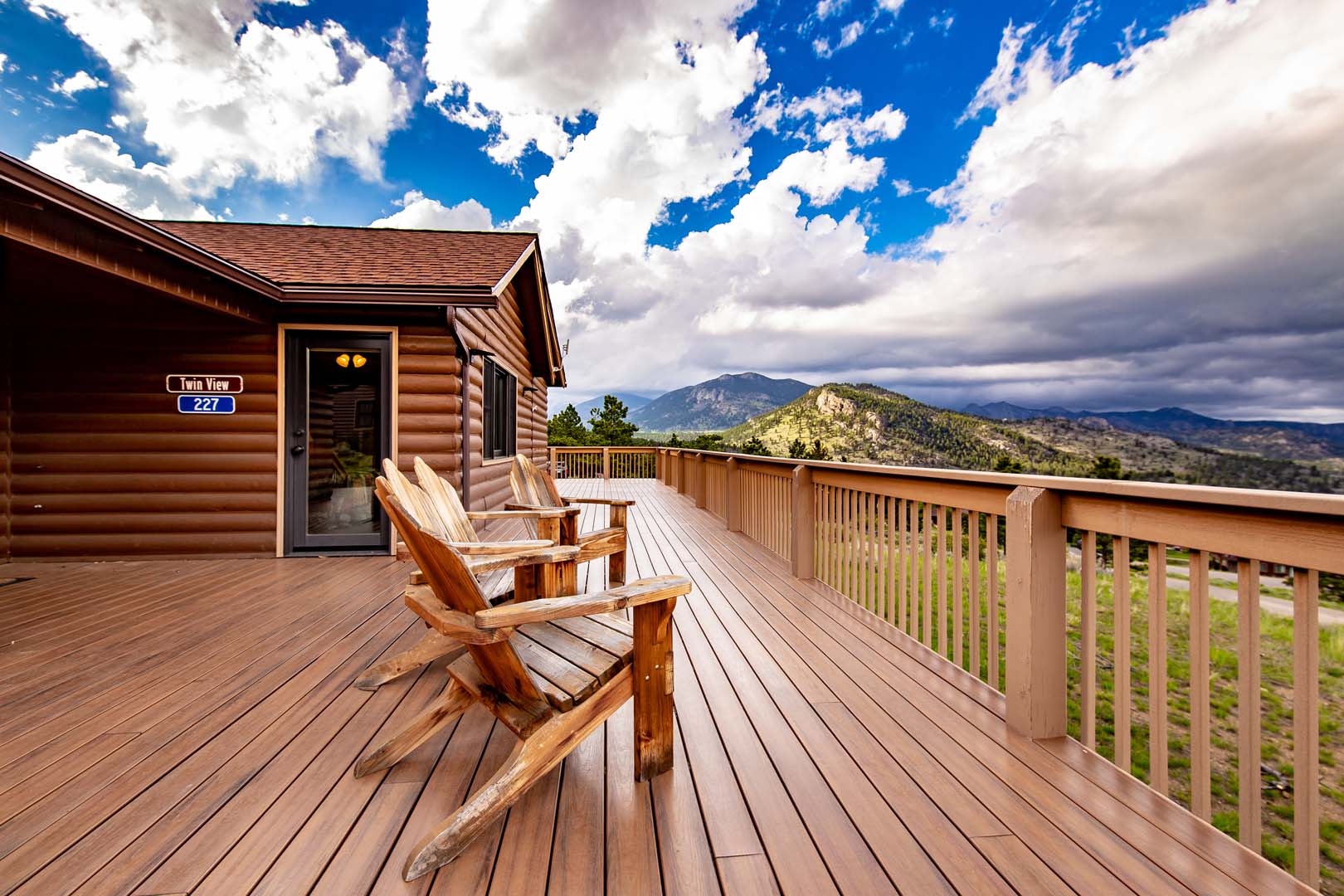 Outdoor patio with chairs overlooking the mountains