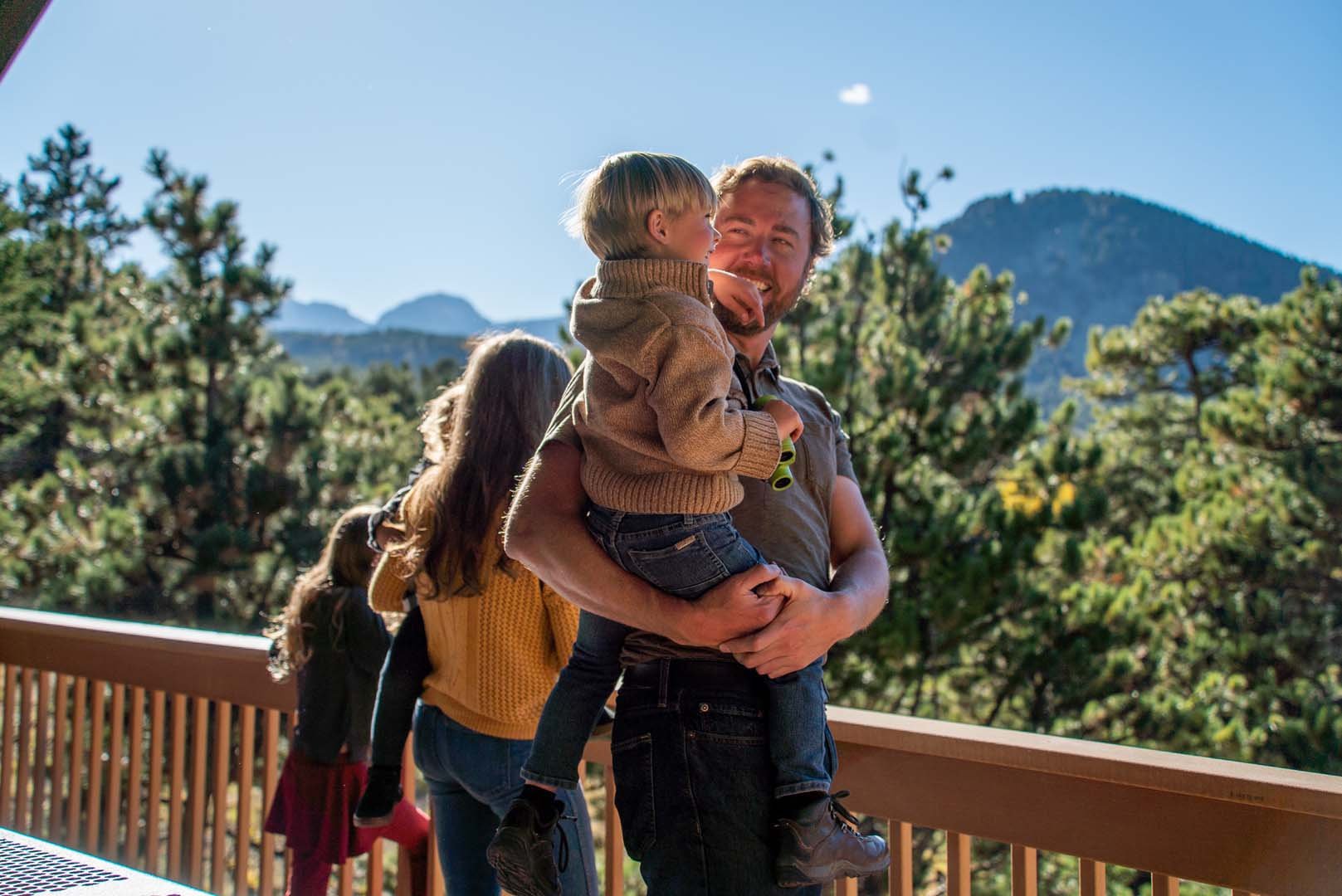 Family looking out at mountains from patio