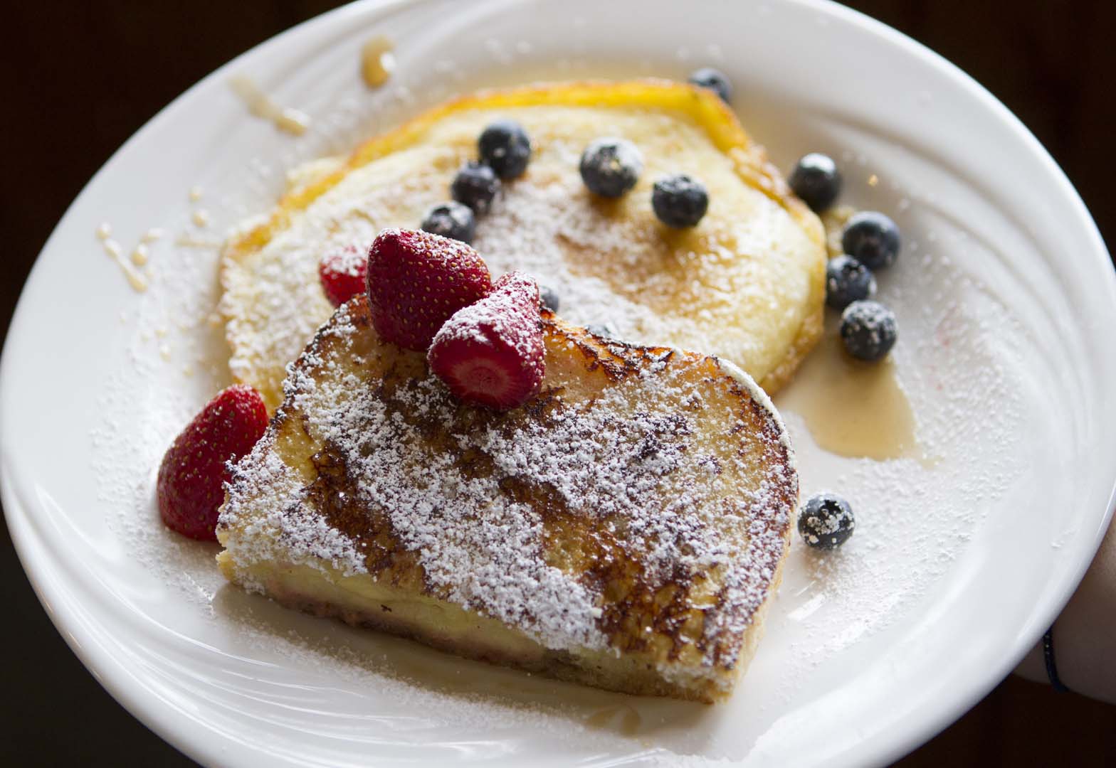 Plate with two pancakes and fruit