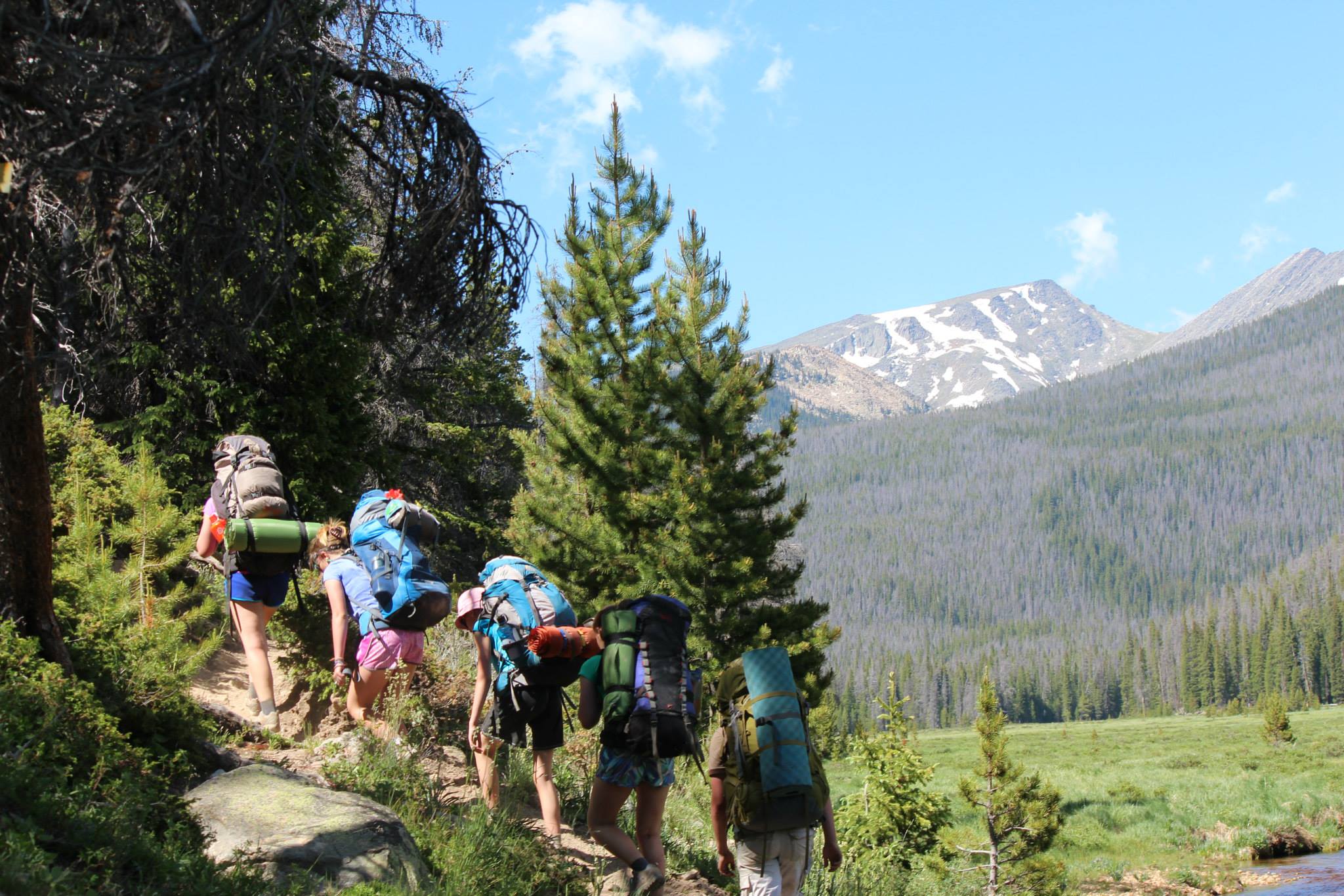 group hiking with gear