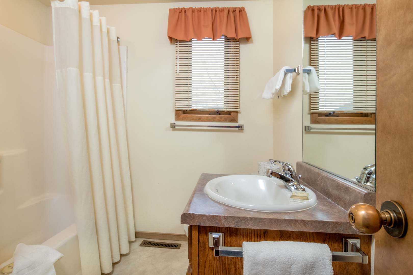 bathroom with view of the sink and shower/tub
