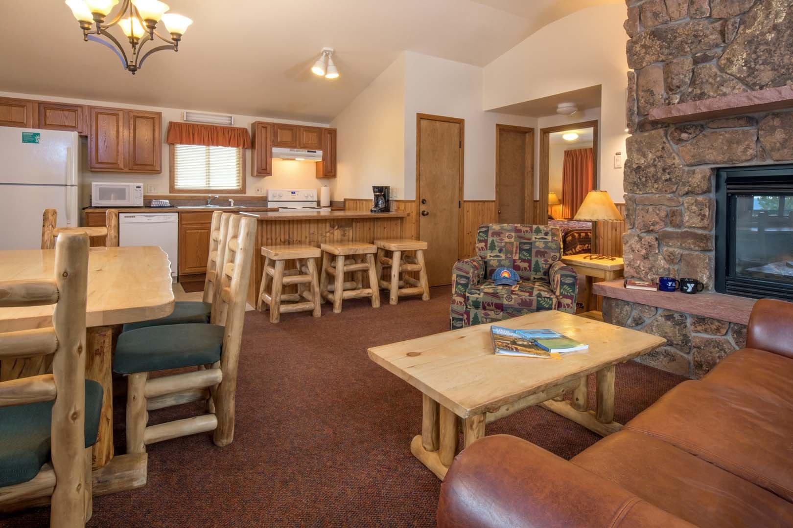 Living room with dining area, sofas, and fireplace