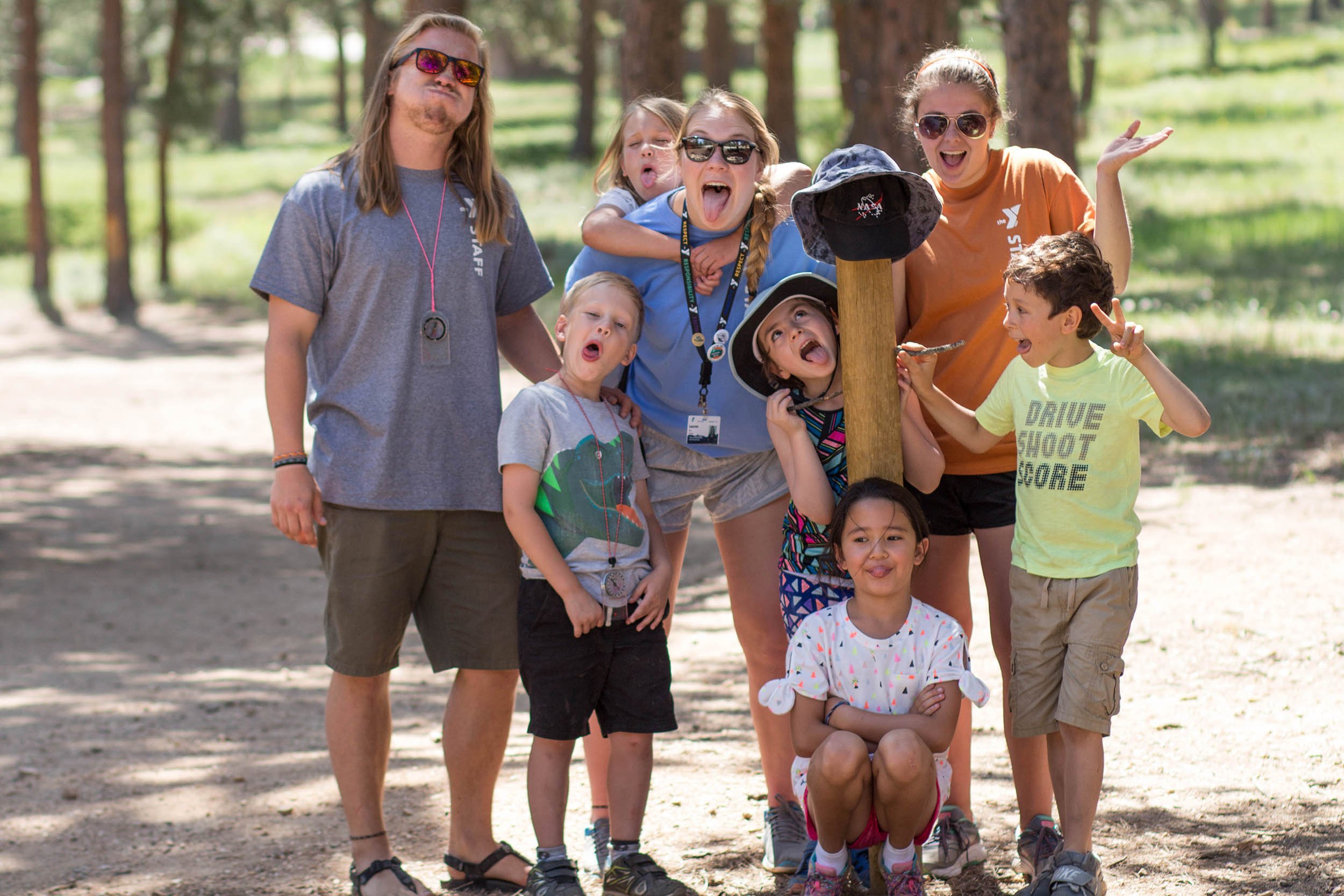 adults and children smiling for the camera