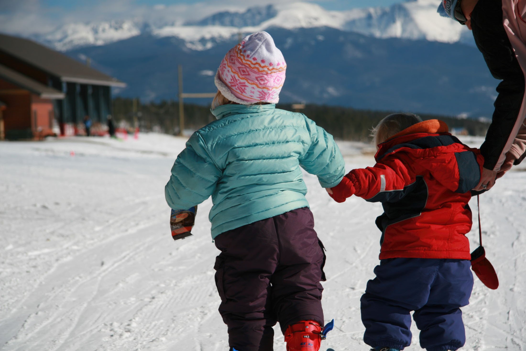 Little kids walking in the snow