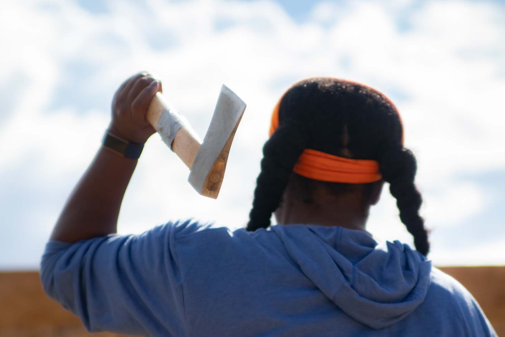 woman throwing axe