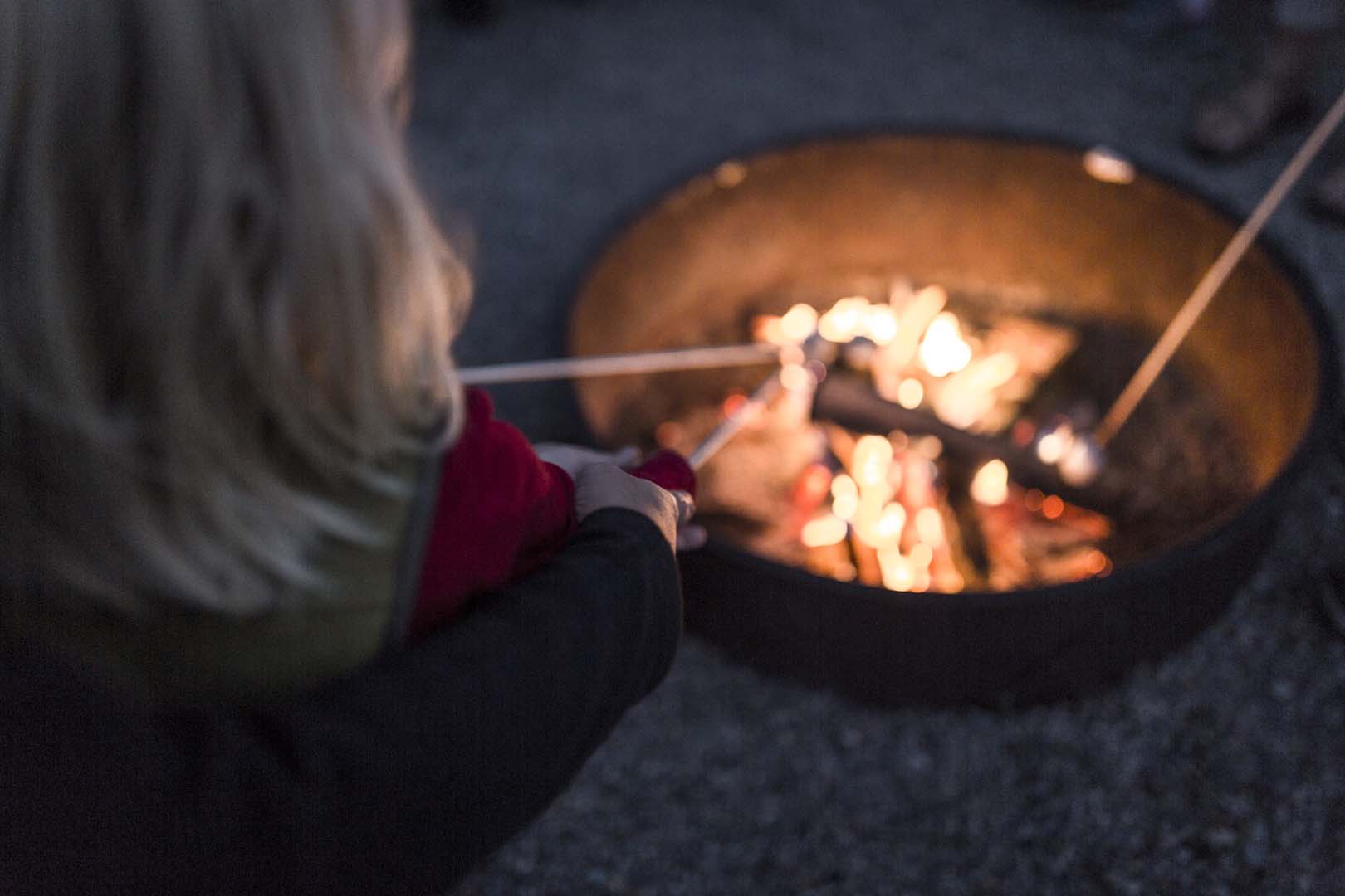 Roasting marshmallows in a camp fire