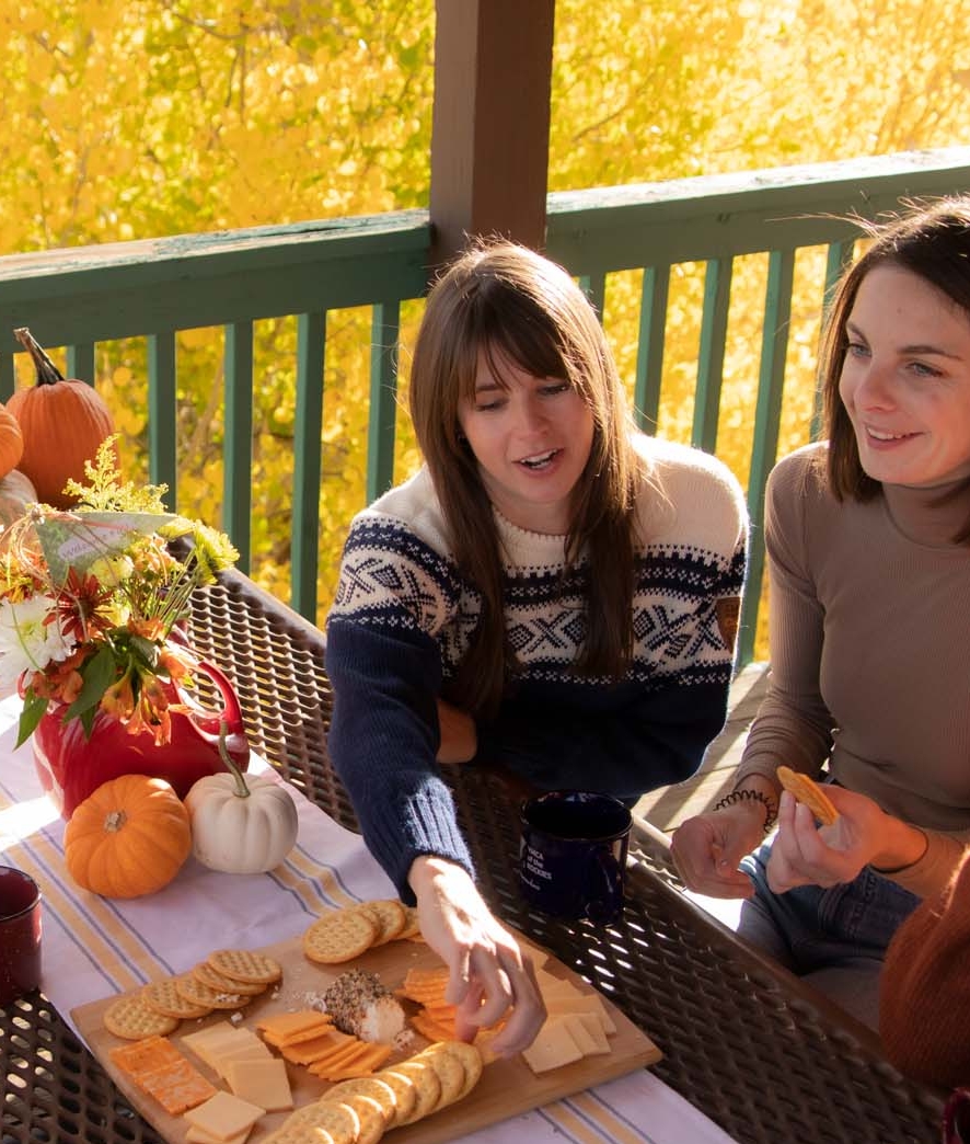 people eating on balcony of cabin