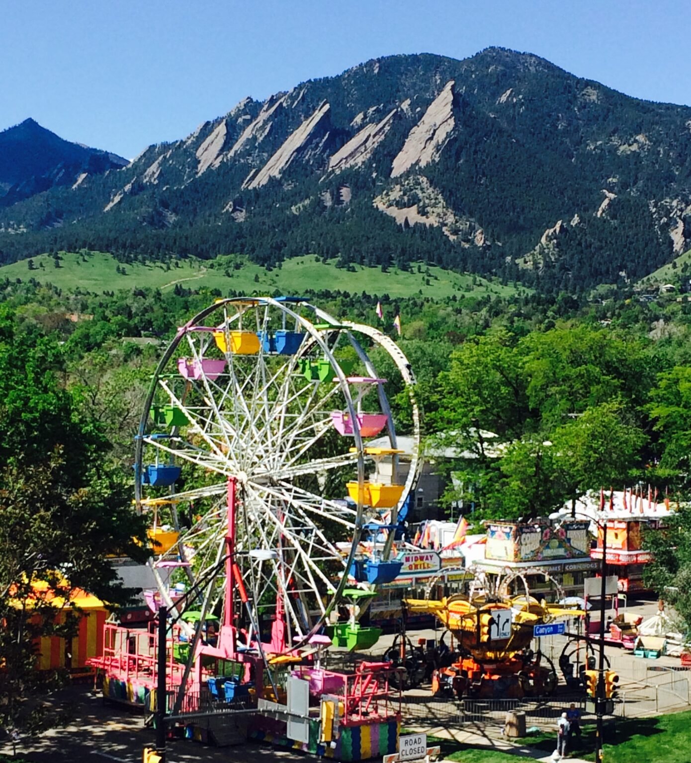 ferris wheel with mountains in the background