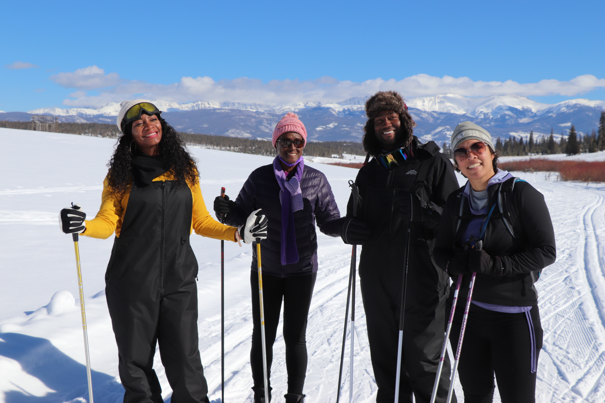 four people skiing