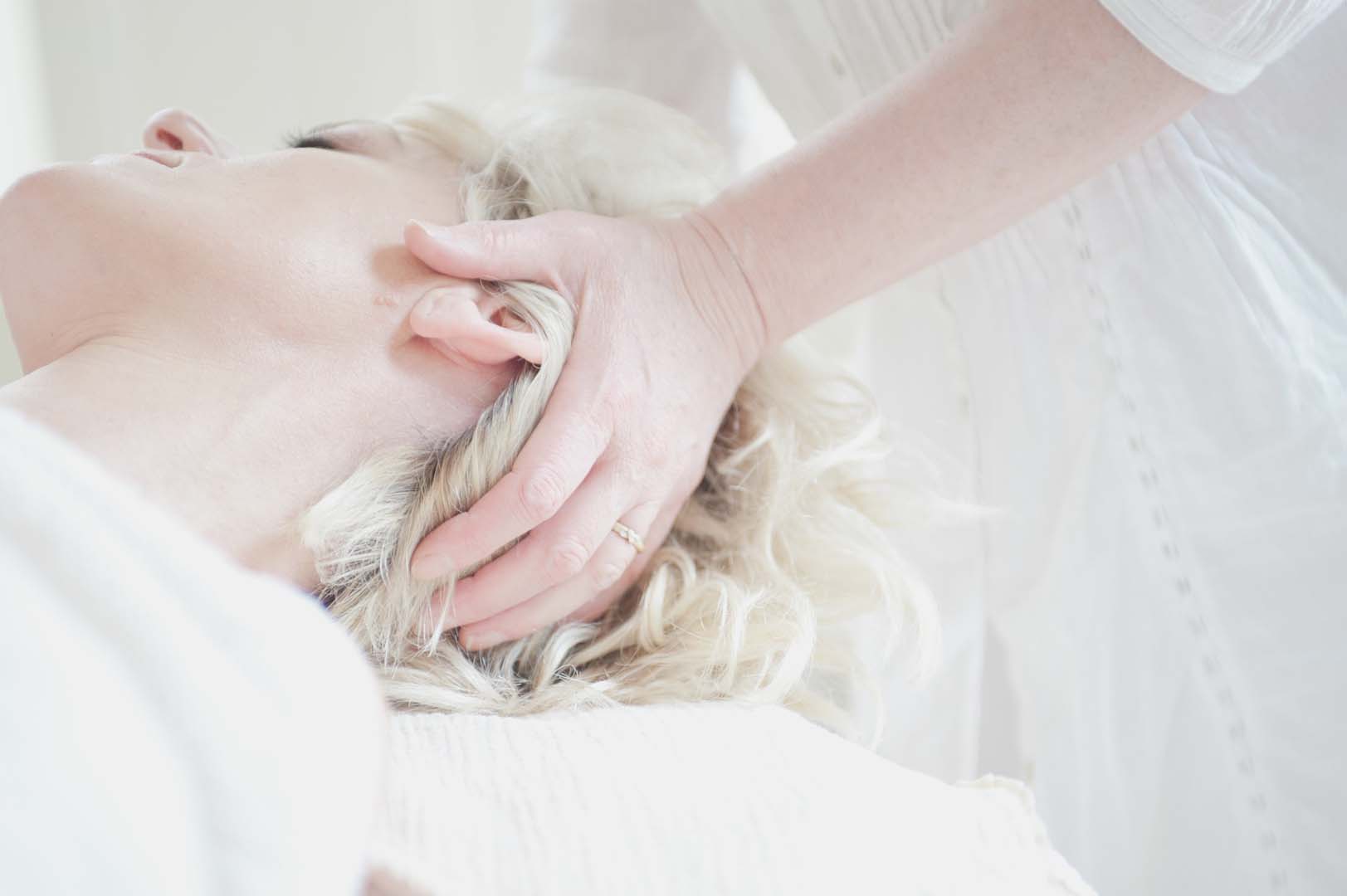 Woman getting a head massage