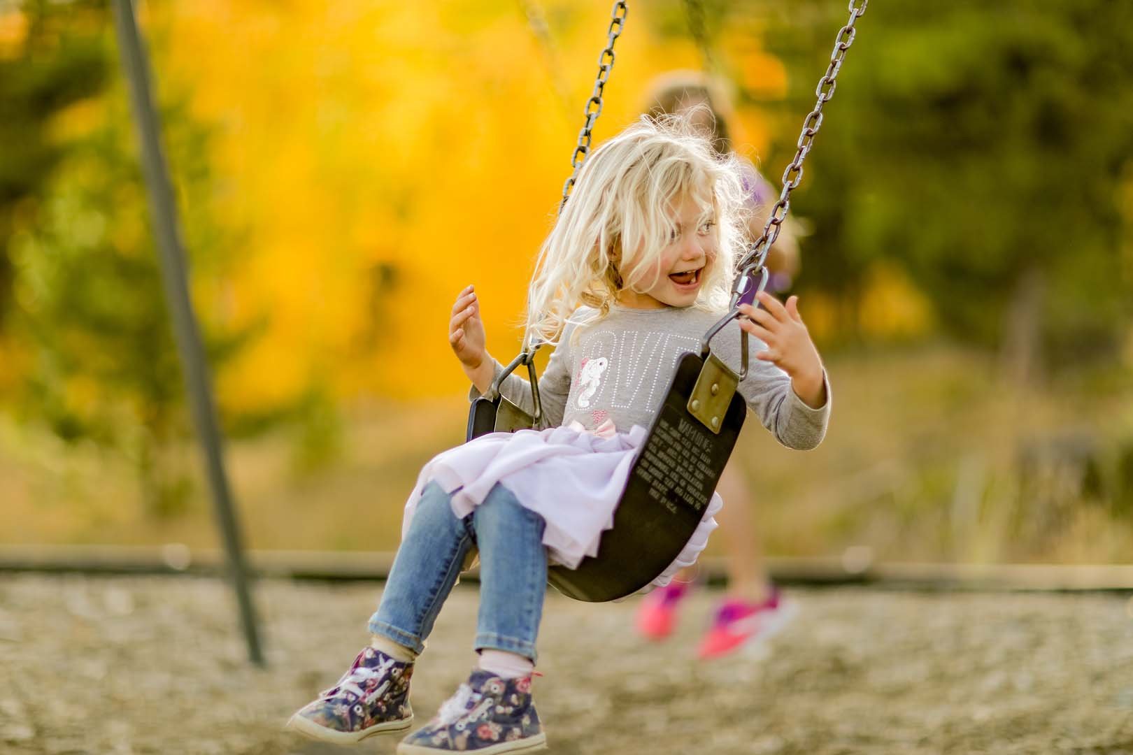 Girl happy on a swing