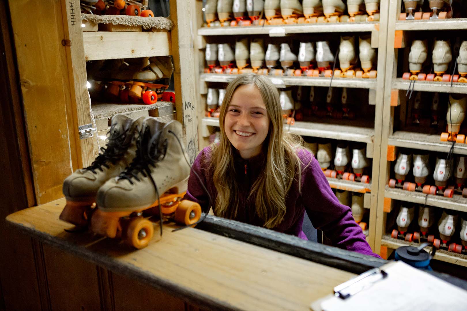 Girl giving out roller skates