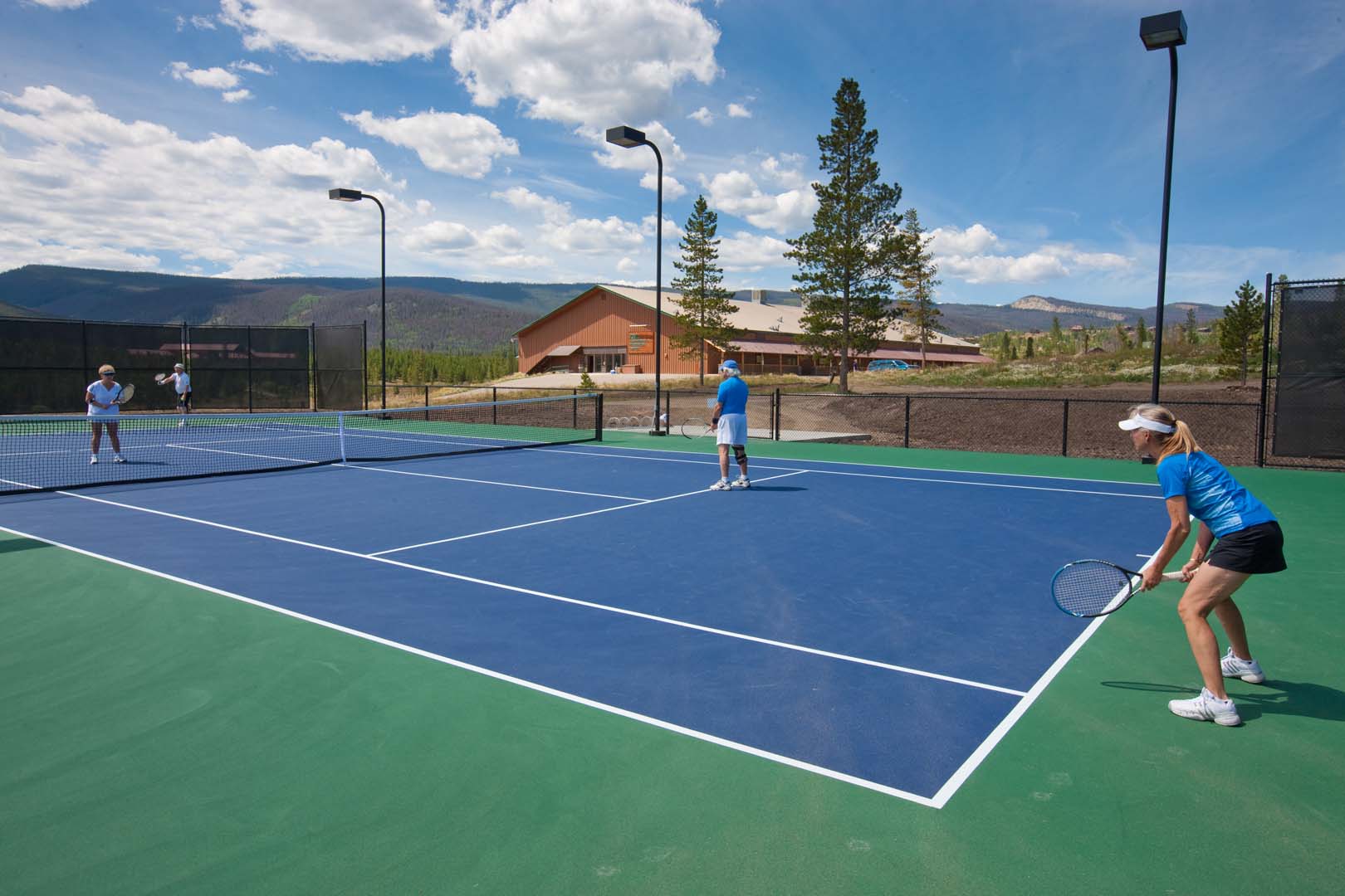 group playing tennis