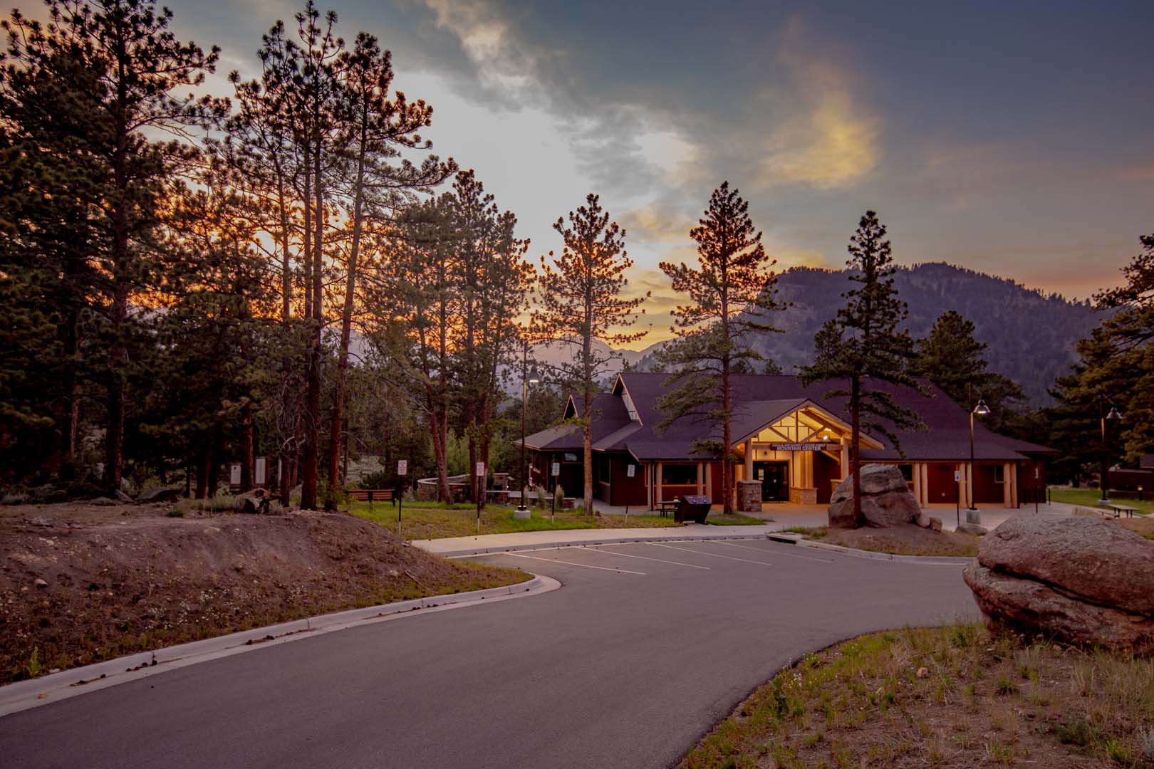 lodge with tress around and sunset