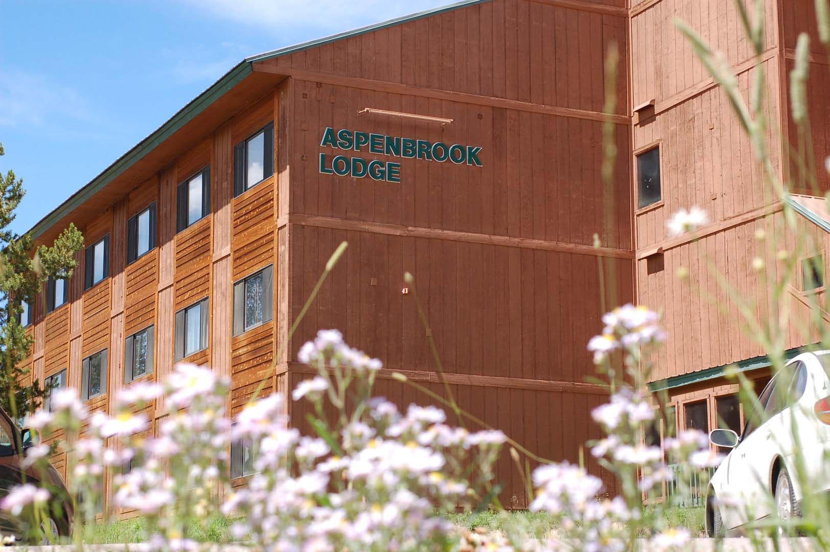 outside of the lodge with flowers