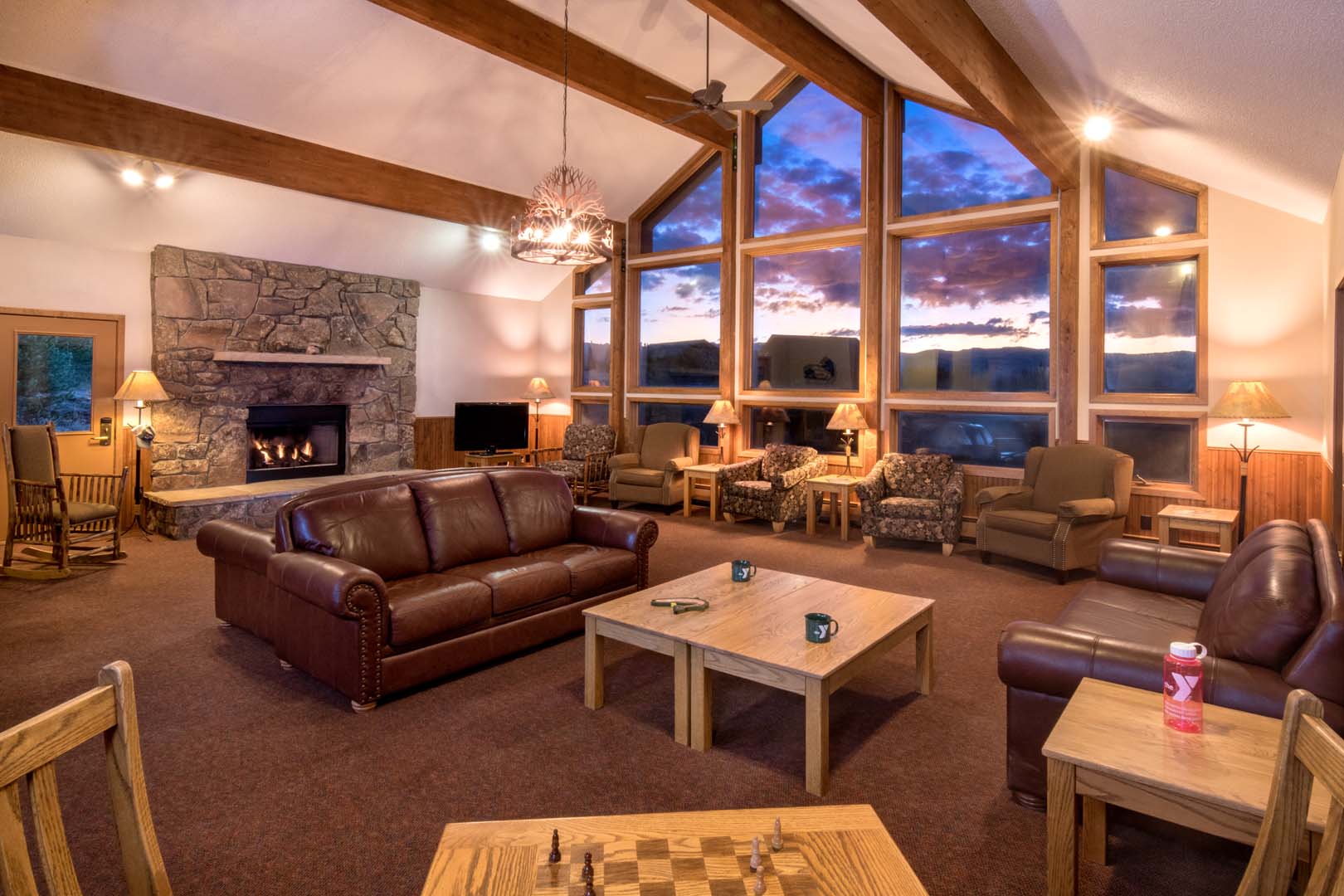 Living room with dining, fireplace area and sofas