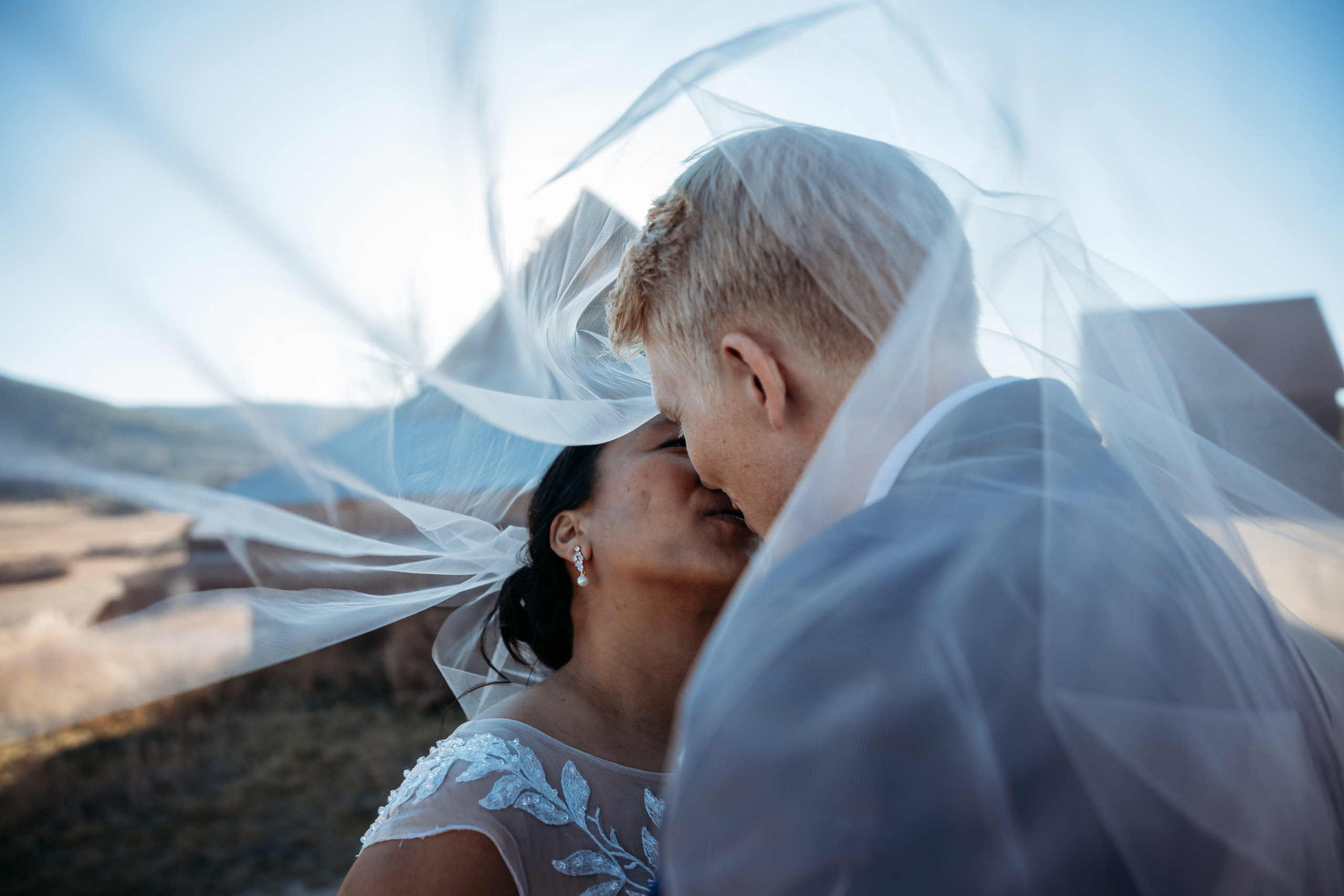 a bride and groom kissing