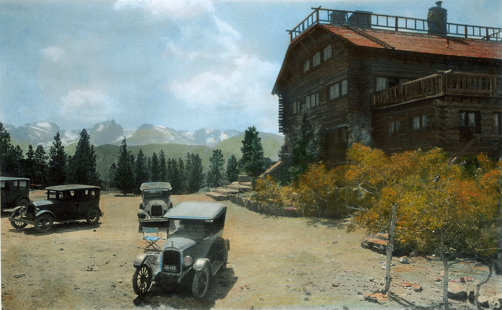 Old cars in front of a house