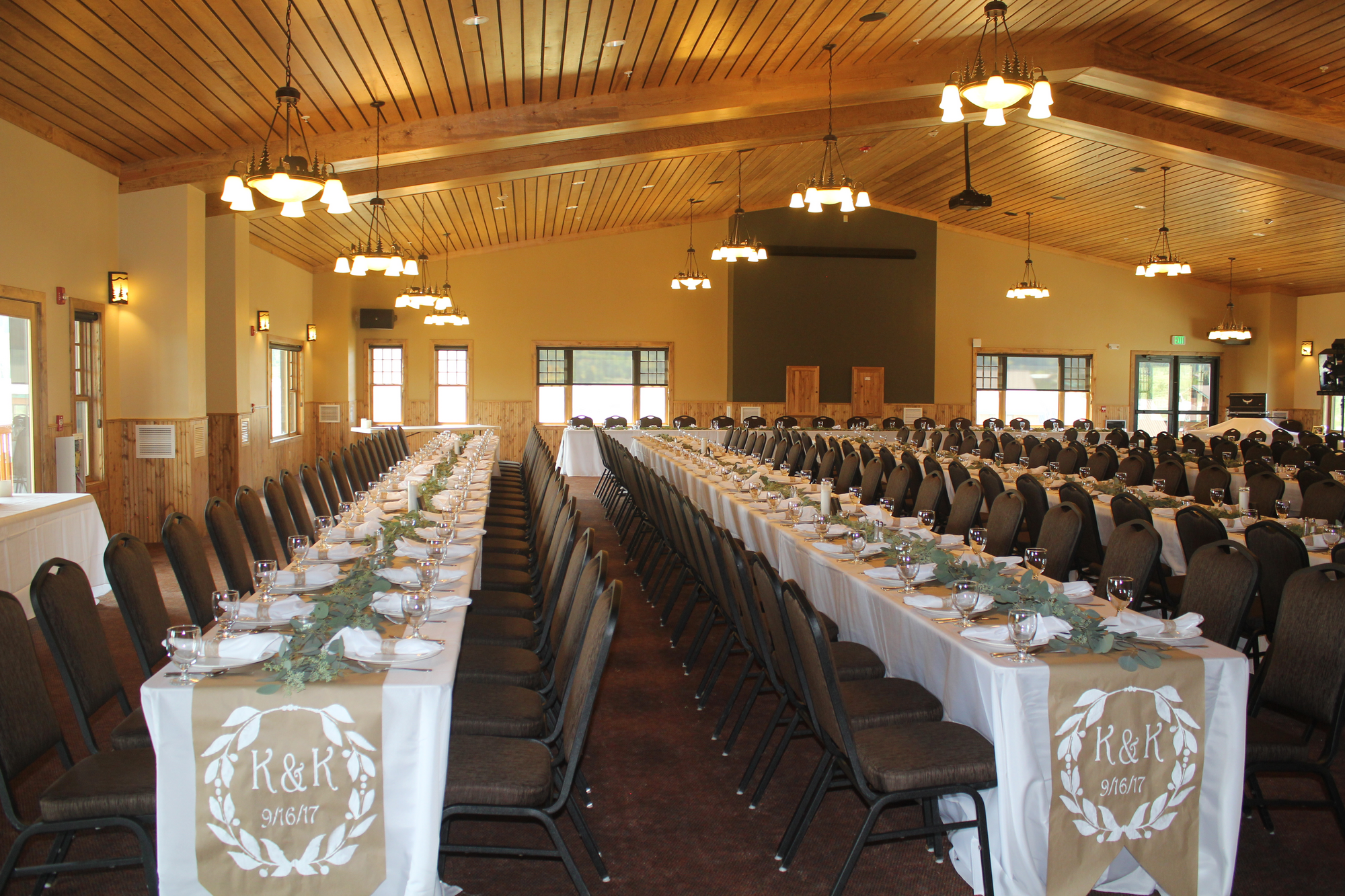 interior of wedding venue with tables decorated