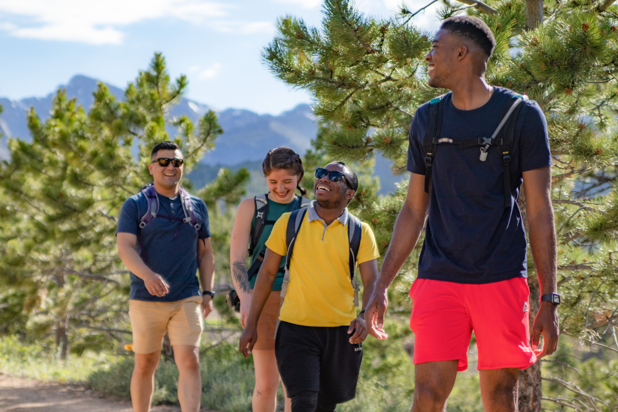 four people hiking