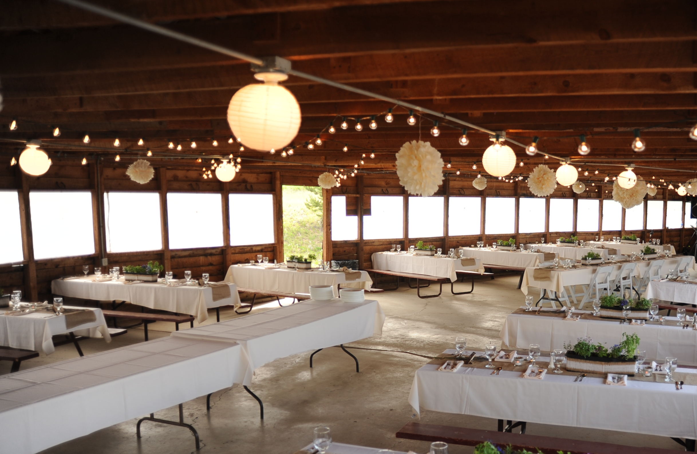 wedding venue decorated with tables and lighting