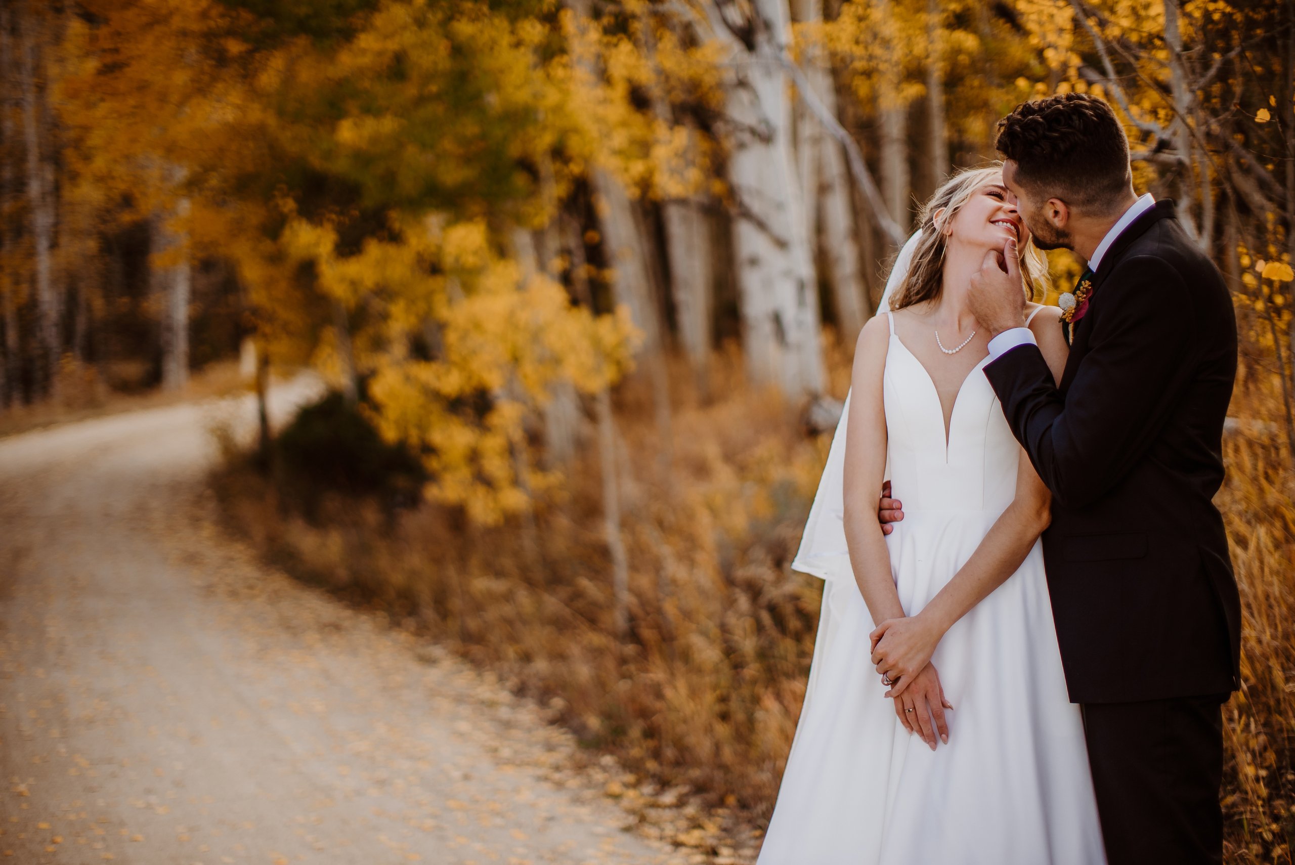 A bride and groom in Fall