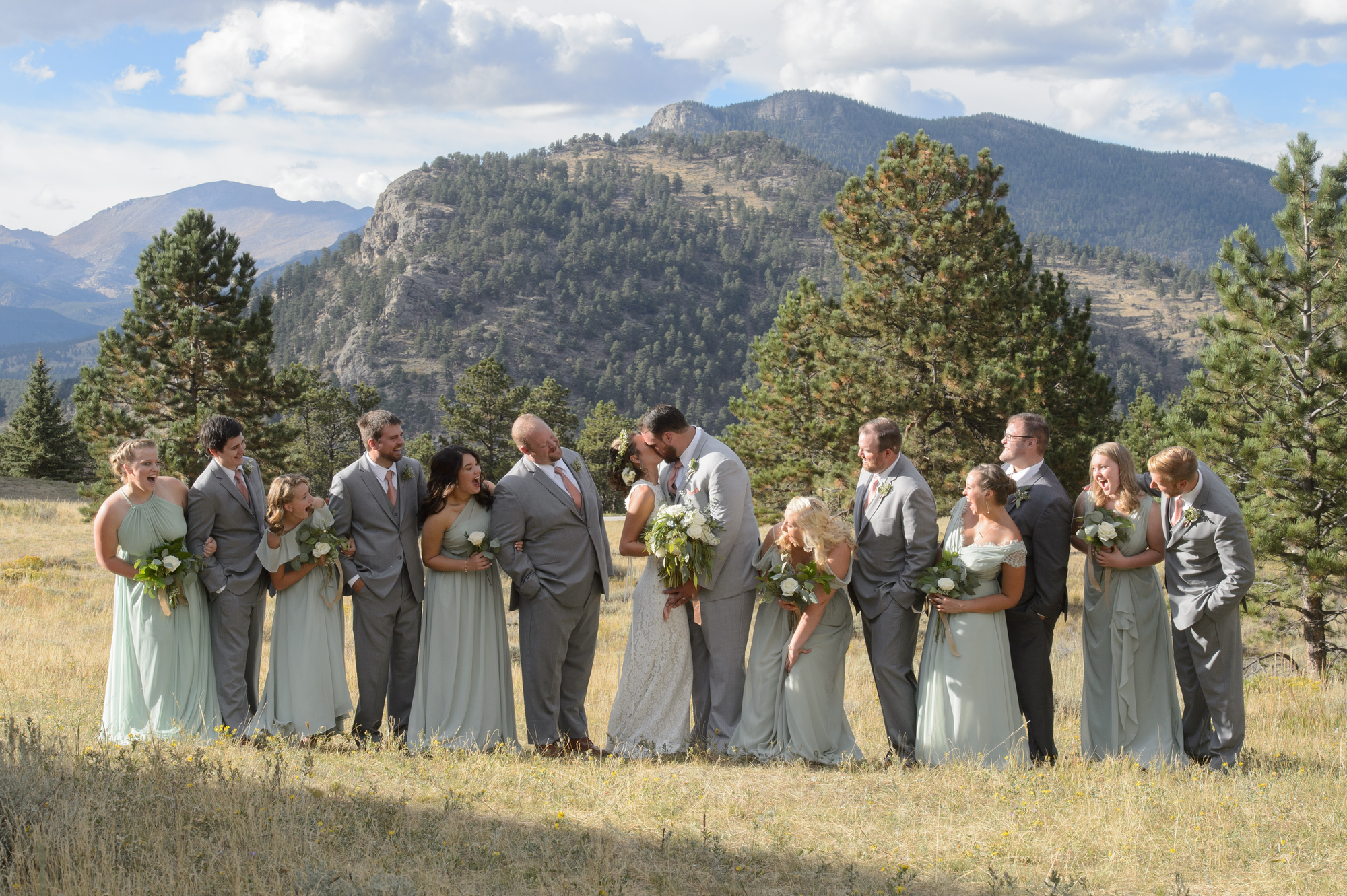 whole wedding party posing for a photo