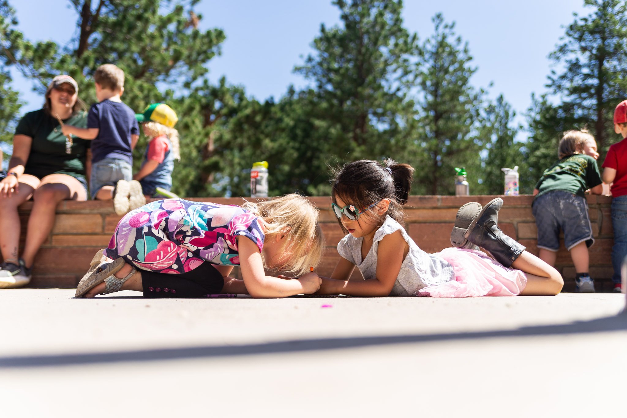 kids playing and drawing outside