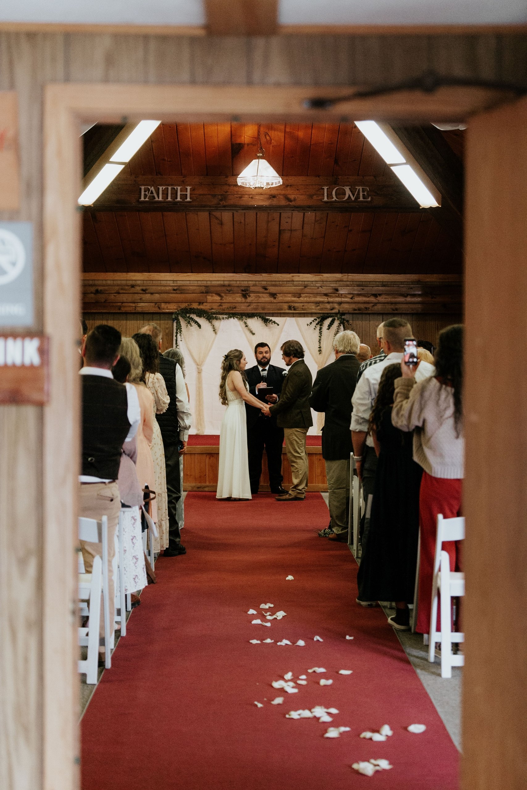 couple walking down aisle