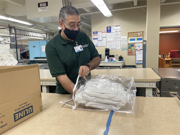 a person packaging an item